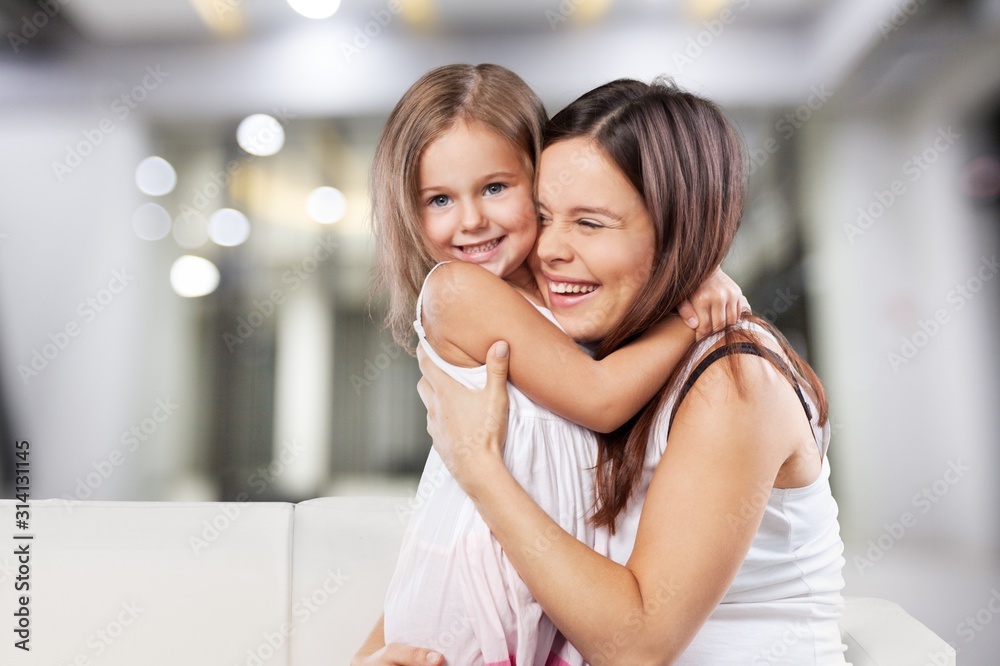 Wall mural Happy Mother and daughter hugging