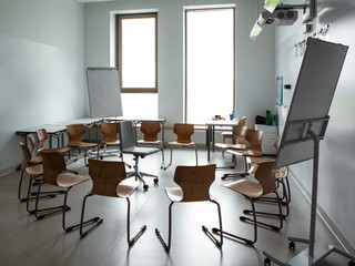 Empty classroom. Modern classroom. Convenient audience for classes. Chairs stand in a circle.