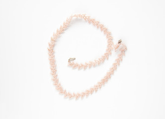 Pink seed bead necklace isolated