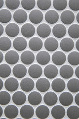 Dark gray penny round tile in a bathroom for flooring or for a kitchen backsplash with a vintage...