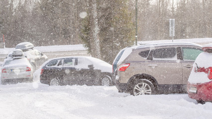 extreme snowfall with cars coverd with a lot of snow in Europe, Slovakia, mountain district