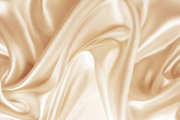 golden silk, satin fabric with large folds, abstract background
