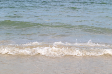 The ocean waves that blow into the beach at the time of clear sky