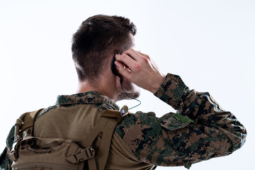 soldier preparing gear for action and checking communication
