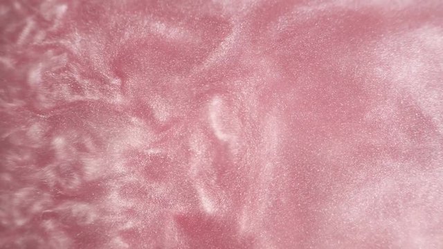 Rheoscopic fluid. Beautiful movement of particles in a liquid. Fantastic patterns and shapes.