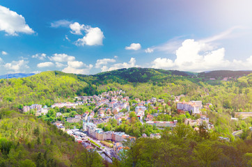 Top aerial panoramic view of Karlovy Vary (Carlsbad) spa town with colorful beautiful buildings,...