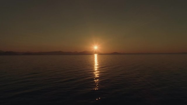 Sea or ocean surface at sunset with beautiful sun reflection.. Aerial, drone video. Video 5 of 5.