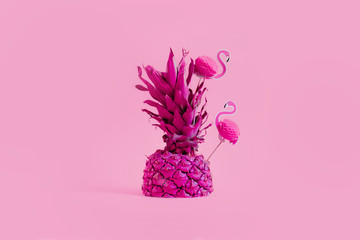 Bright pineapple with pink flamingo. Creative concept of summer party drinks 