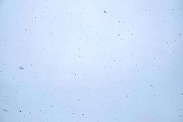 Winter sky with falling snow