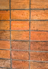 Terracotta red brick floor, is burned at high temperatures to make it resistant.