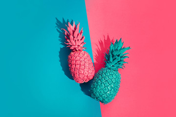 Color pineapple on pink and blue background. Surreal minimalistic art