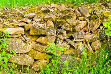 Summer farmland stone fence view. Stone fence view. Countryside stone fence scene. Rural stone fence landscape