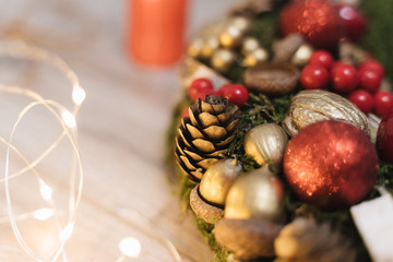 Christmas wreath with pine cones and red balls, festive decoration