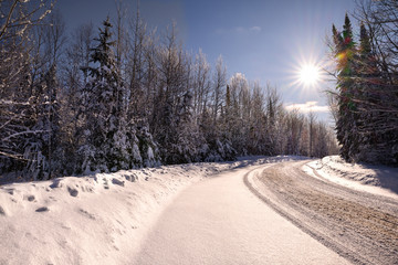 sunbeam on snow covered road