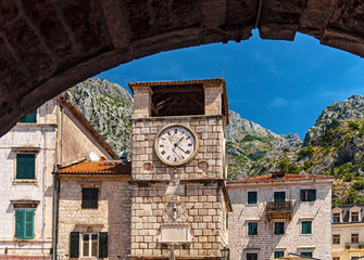 Fototapeta na wymiar 17th century Clock Tower on Arms Square - main square of historic part of Kotor city