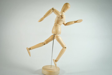 wooden mannequin with money