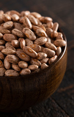Bowl of Pinto Beans on a Rustic Wooden Table