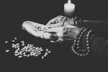 an old woman witch looks into a girl's hands and guesses fate