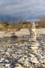 Pebble tower near French river in drome. Zen, relaxation and tranquility