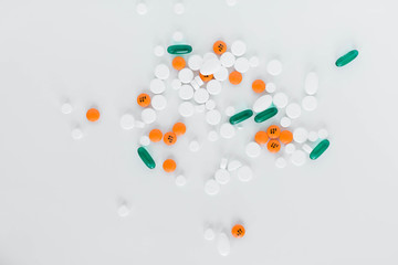 Group of assorted prescription pills on white background