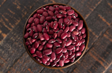 Bowl of Red Kidney Beans on a Rustic Wooden Table