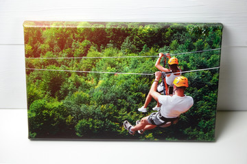 Canvas print on white table. Photo with gallery wrap method of canvas stretching on stretcher bar....