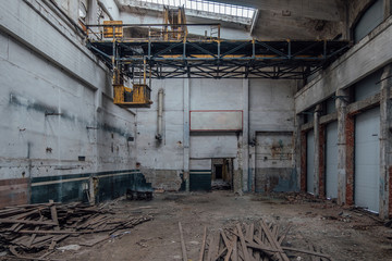 Old abandoned factory interior. Empty ruined workshop