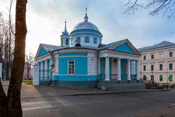 Orthodox church of blue color with white columns and other elements of ornament