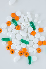 Group of assorted prescription pills on white background