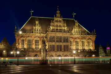 Fototapeta premium Tram passing in front of Town hall in the market square, Bremen, Germany