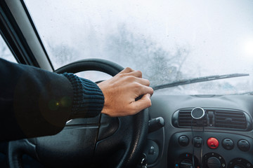 driving a car on a winter snowy day. Cold ride.