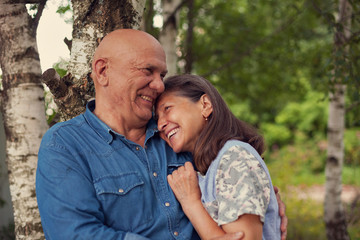Fototapeta premium cute older man and woman in birch grove