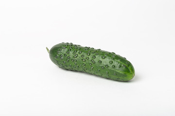 One whole green and fresh Cucumber Isolated on a white background. Non-gmo healthy vegetarian eating concept
