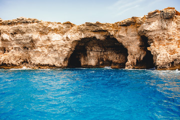 Panorama beach Blue Lagoon Comino Malta. Rocky coast with window and arch Mediterranean Sea