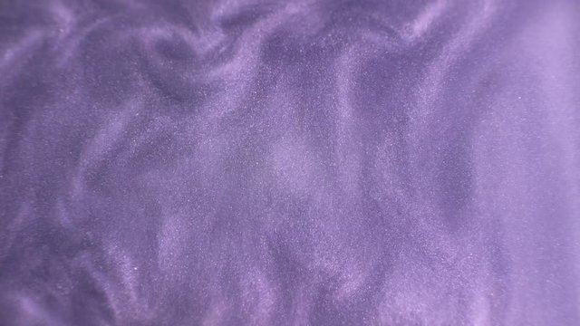 Rheoscopic fluid. Beautiful movement of particles in a liquid. Fantastic patterns and shapes.