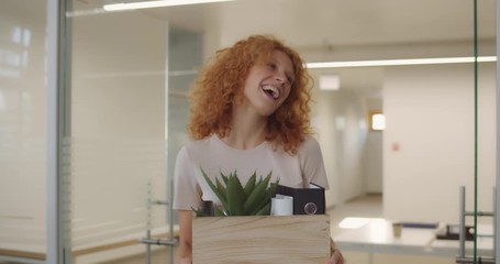 Happy young woman getting promotion and leaving office with things in box. Smilling office workers gratulating female coworker who moving up career ladder. Concept of work,career, success.