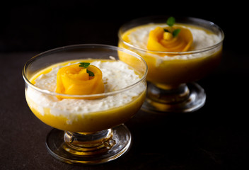 Sweet tapioca pudding with coconut milk and fresh mango flowers