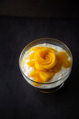 Sweet tapioca pudding with coconut milk and fresh mango flowers
