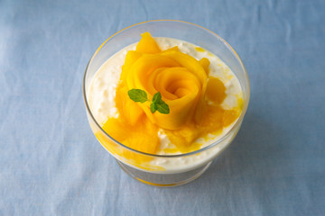 Sweet tapioca pudding with mint, coconut milk and fresh mango flowers