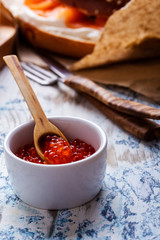 Cured salmon and pot of  salmon caviar