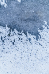 Ice texture, interesting frozen lake patterns, naturally created forms. Frozen river's water in the winter in mount Vitosha, near Sofia, Bulgaria. Ice Age climate changes.