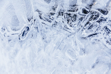 Ice texture, interesting frozen lake patterns, naturally created forms. Frozen river's water in the winter in mount Vitosha, near Sofia, Bulgaria. Ice Age climate changes.