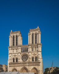 Fototapeta na wymiar Notre Dame Cathedral under blue sky, in Paris, France