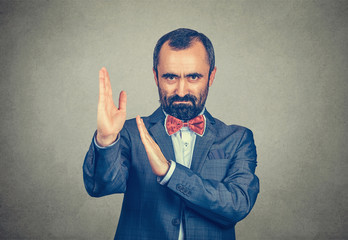 man shows karate chop gesture