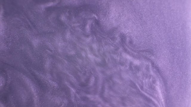 Rheoscopic fluid. Beautiful movement of particles in a liquid. Fantastic patterns and shapes.