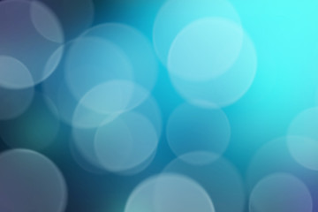 Blue bokeh lights abstract background. Bokeh on the background blurred the natural blue and white.