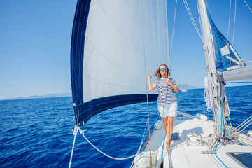 Beautiful woman relaxing On Yacht in Greece