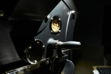 Technology and equipment for processing coffee. Details of a professional coffee roasting machine. Close-up.