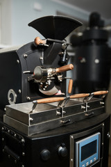 Coffee processing technology. A modern professional coffee roasting machine. Close-up.