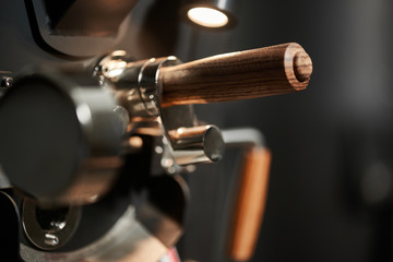 Details of a machine for roasting coffee from metal and wood. Close-up.